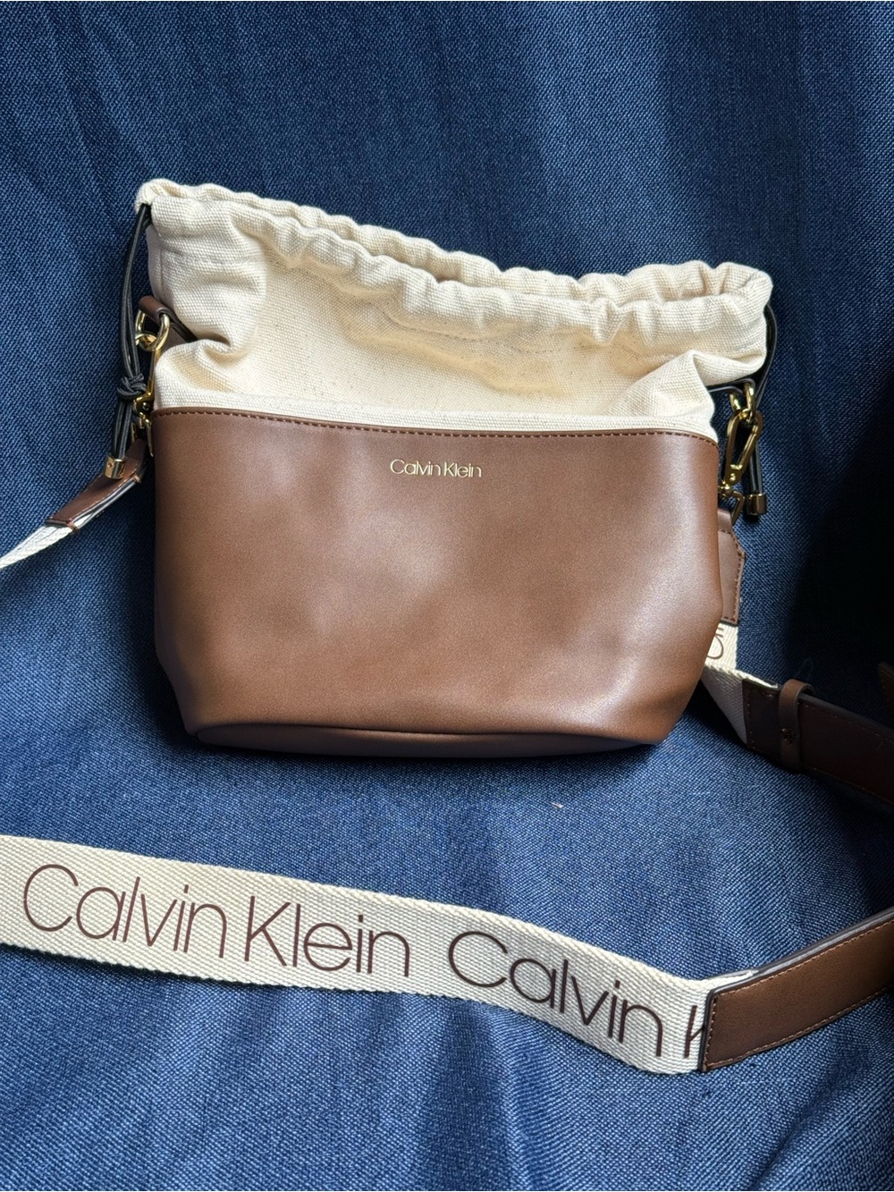 NWOT 2021 Calvin Klein Amber Cream Canvas Brown Leather Bucket Bag Logo Crossbod